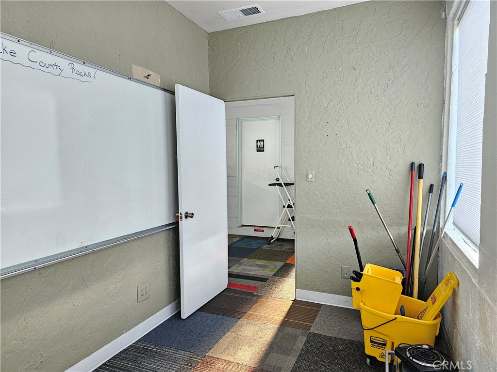21298 Calistoga Road Middletown, CA 95461 - Photo 7 of 20 a view of a hallway with a chair and potted plant