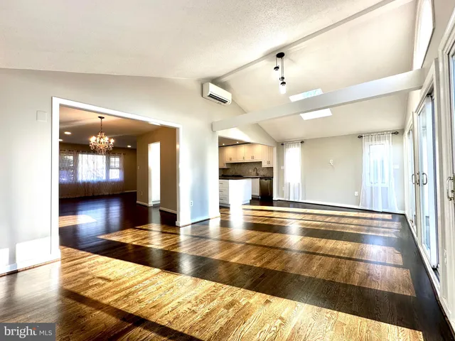 a view of gallery with wooden floor