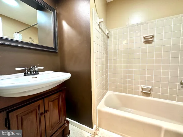 a bathroom with a sink and a bathtub