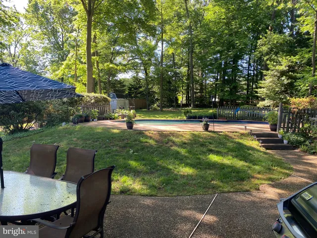 a view of a backyard with sitting area