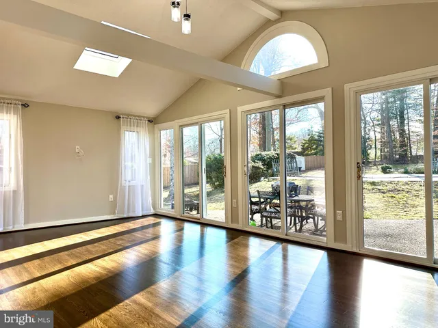 a view of an entryway with wooden floor