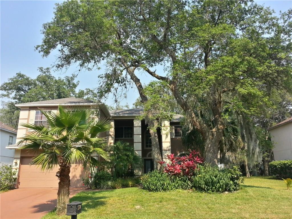 2249 Twisted Pine Road Ocoee, FL 34761 - Photo 1 of 1 a front view of a house with garden