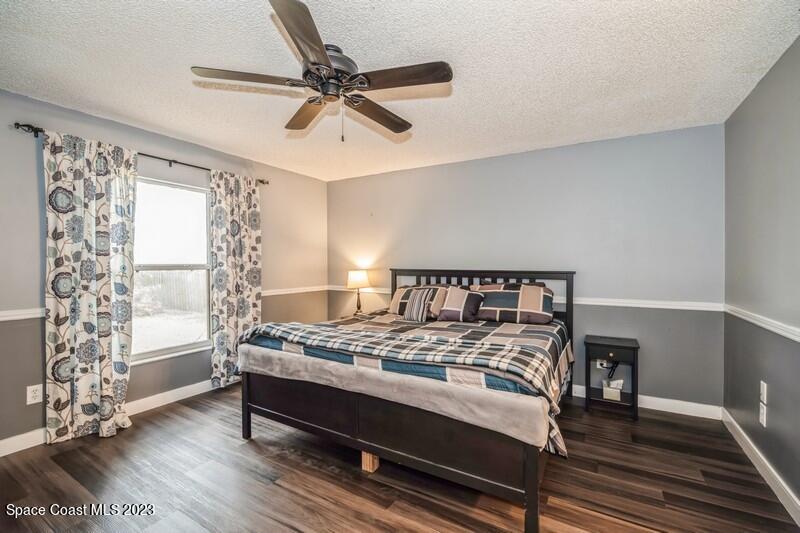 6475 Addax Avenue Cocoa, FL 32927 - Photo 16 of 31 a bedroom with a bed and a window