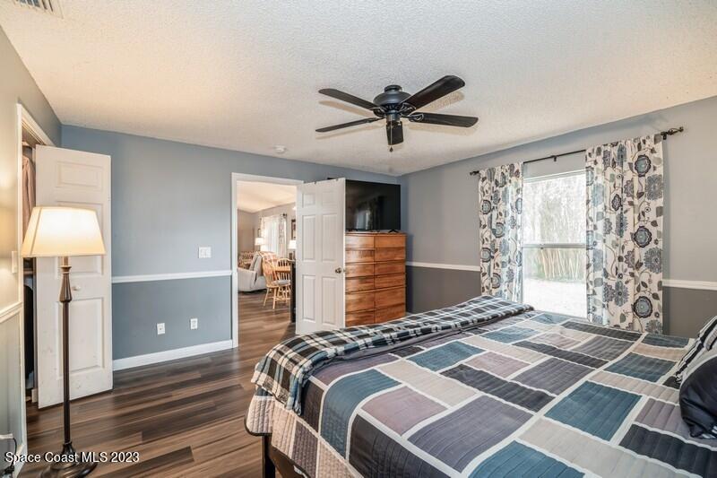 6475 Addax Avenue Cocoa, FL 32927 - Photo 20 of 31 a bedroom with a bed and a window