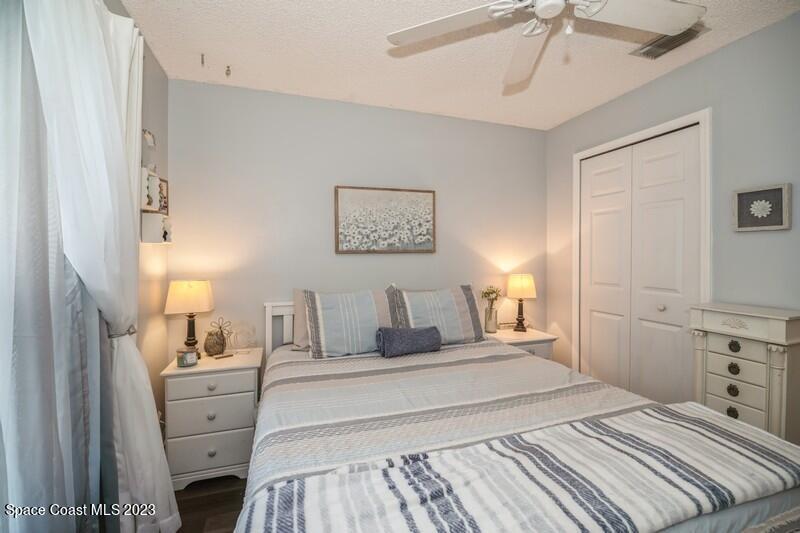 6475 Addax Avenue Cocoa, FL 32927 - Photo 22 of 31 a bedroom with a large bed and a window