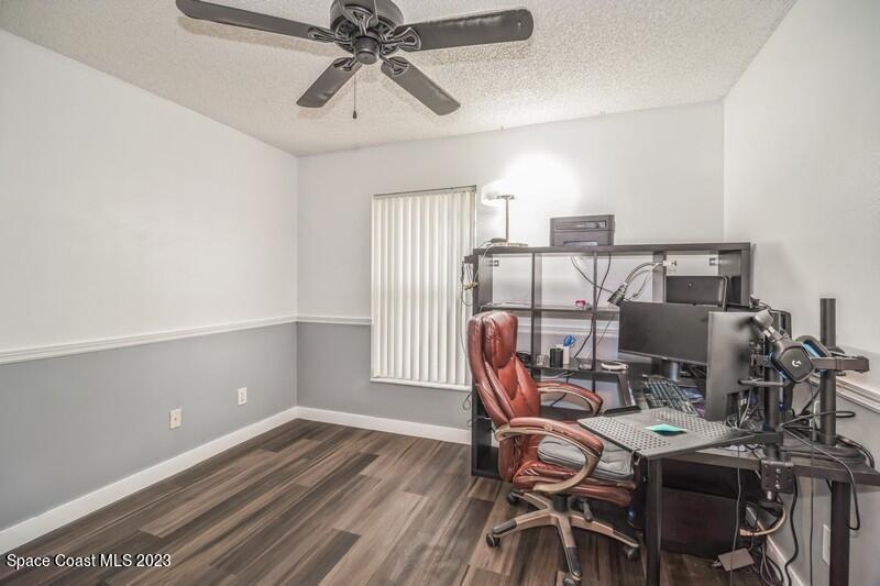 6475 Addax Avenue Cocoa, FL 32927 - Photo 24 of 31 a workspace with furniture and wooden floor