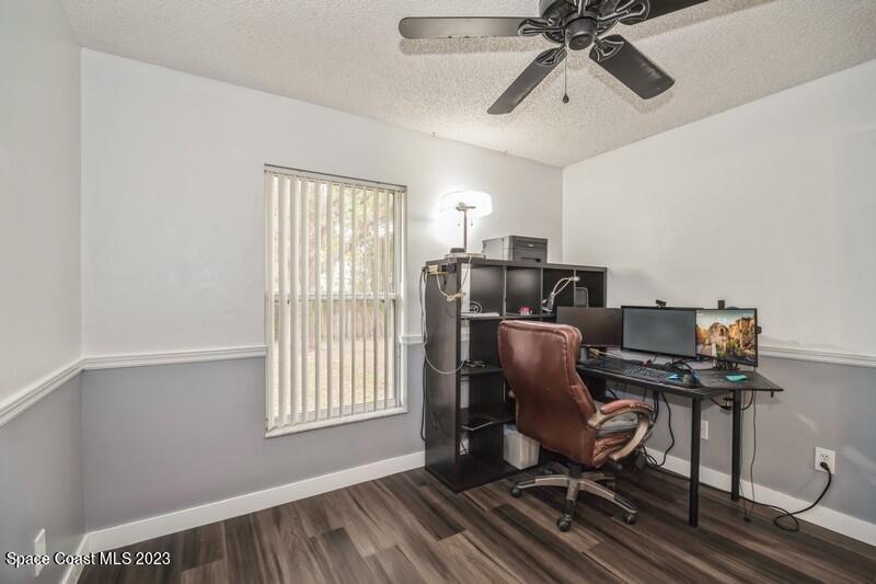 6475 Addax Avenue Cocoa, FL 32927 - Photo 25 of 31 a view of workspace with wooden floor windows