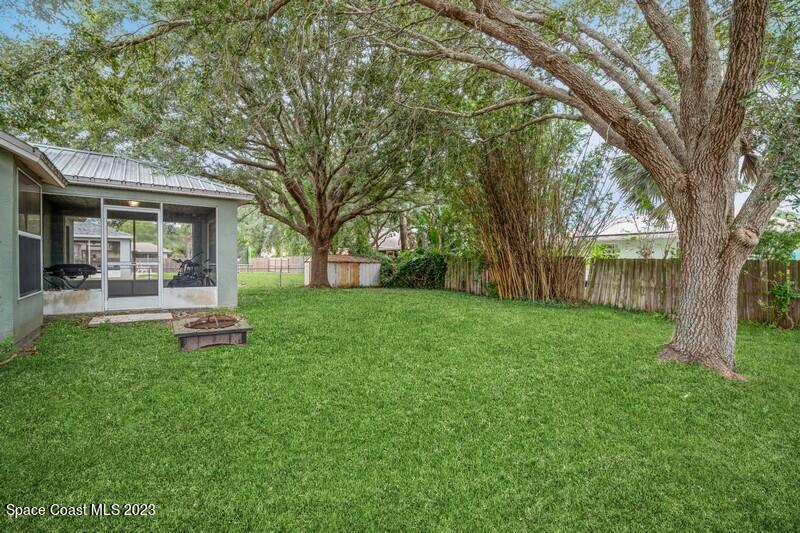 6475 Addax Avenue Cocoa, FL 32927 - Photo 28 of 31 a white house that has a tree in front of it