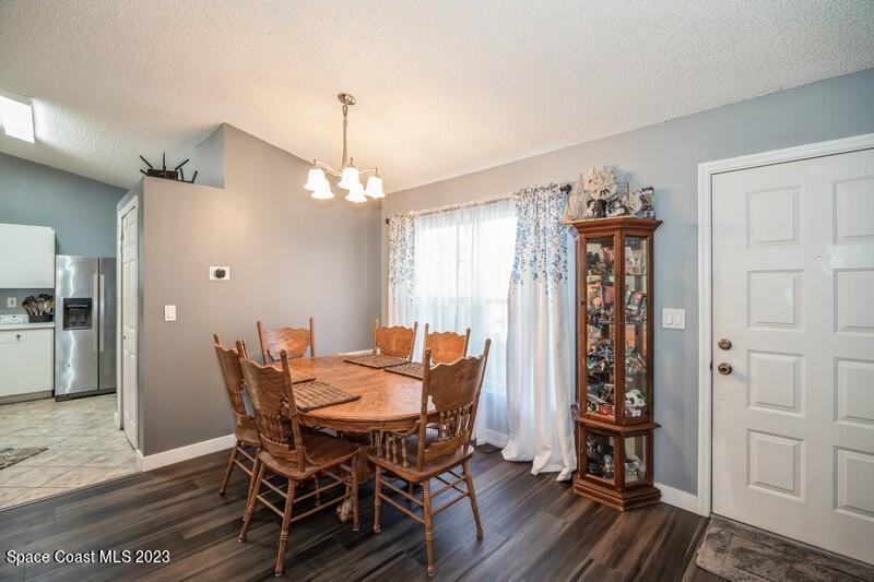 6475 Addax Avenue Cocoa, FL 32927 - Photo 9 of 31 a dining room with furniture and window