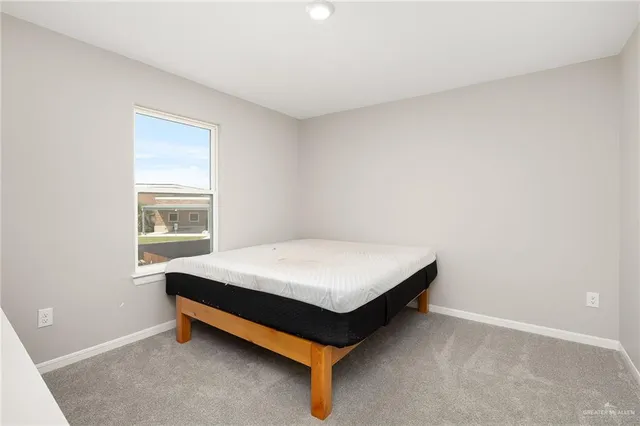 a room with a bed and window