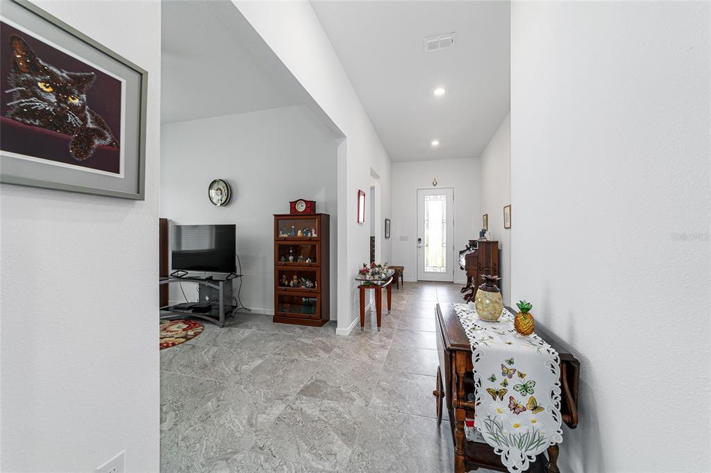 6046 Southwest 86th Circle Ocala, FL 34481 - Photo 13 of 79 a room with furniture and a flat screen tv