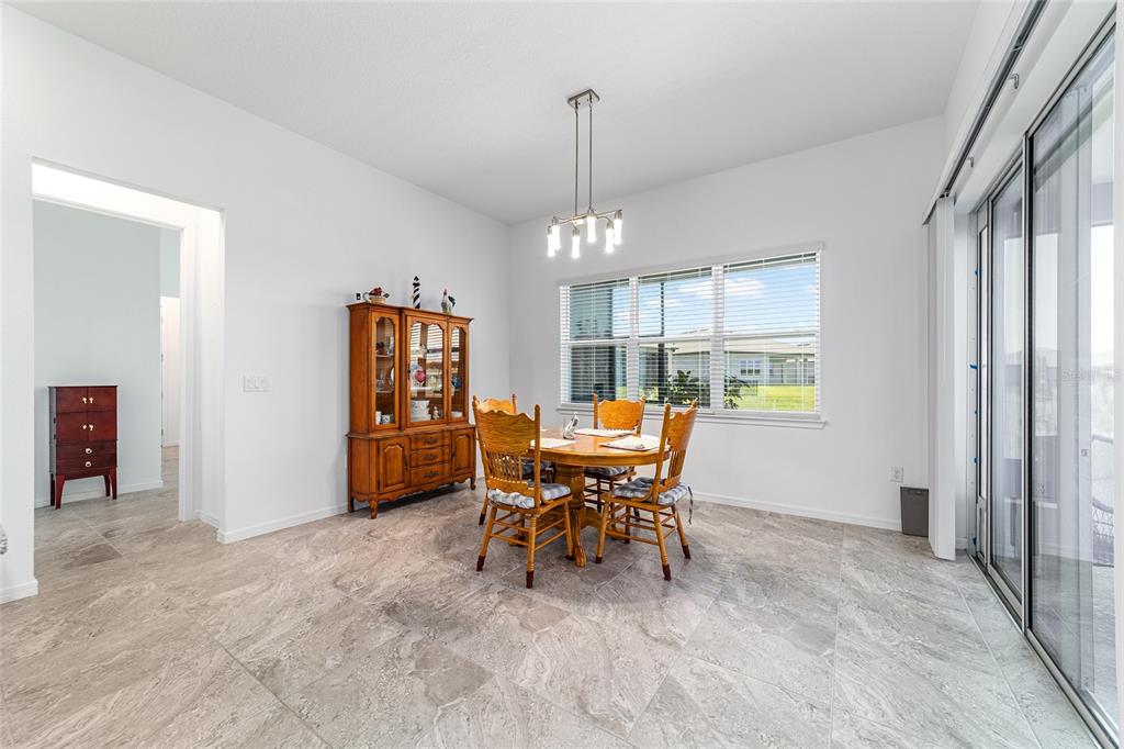 6046 Southwest 86th Circle Ocala, FL 34481 - Photo 27 of 79 a view of a dining room with furniture window and outside view