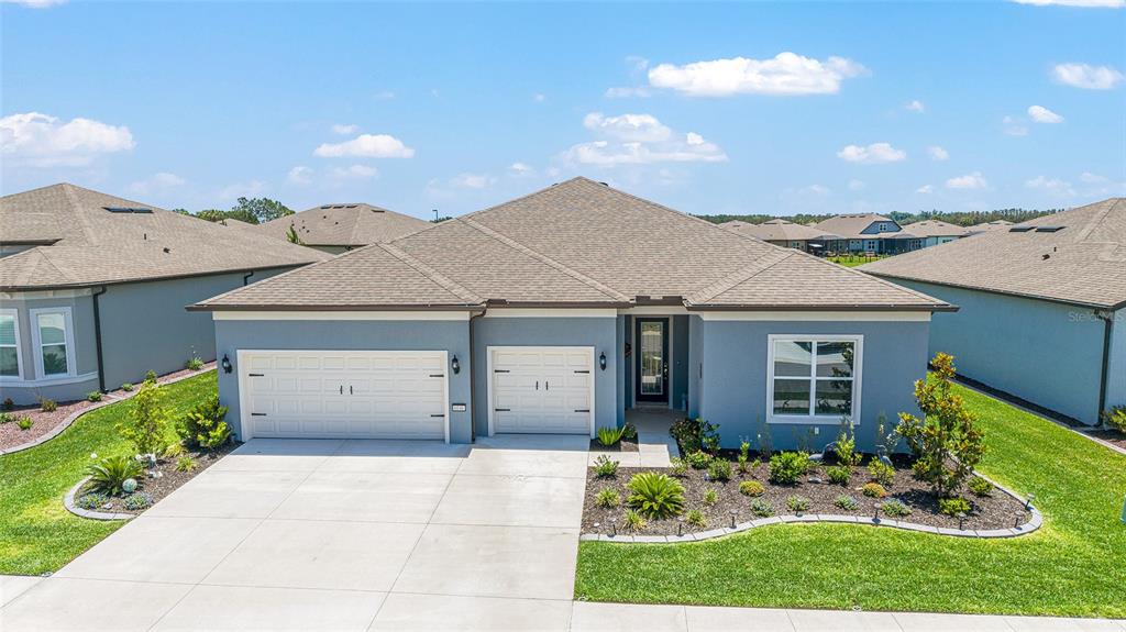 6046 Southwest 86th Circle Ocala, FL 34481 - Photo 4 of 79 a view of a house with a yard and plants