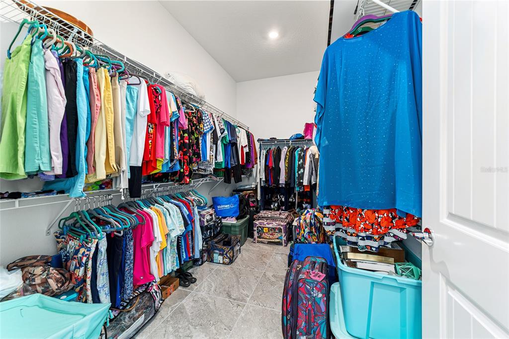 6046 Southwest 86th Circle Ocala, FL 34481 - Photo 42 of 79 a view of walk in closet with clothes