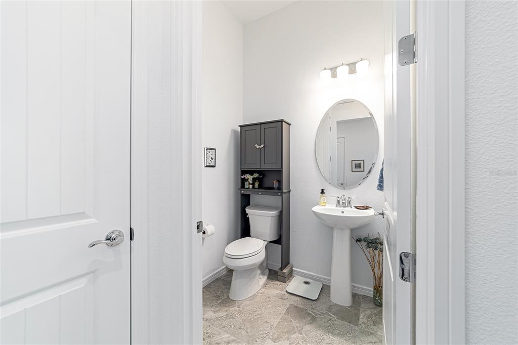 6046 Southwest 86th Circle Ocala, FL 34481 - Photo 48 of 79 a bathroom with a toilet a sink and mirror