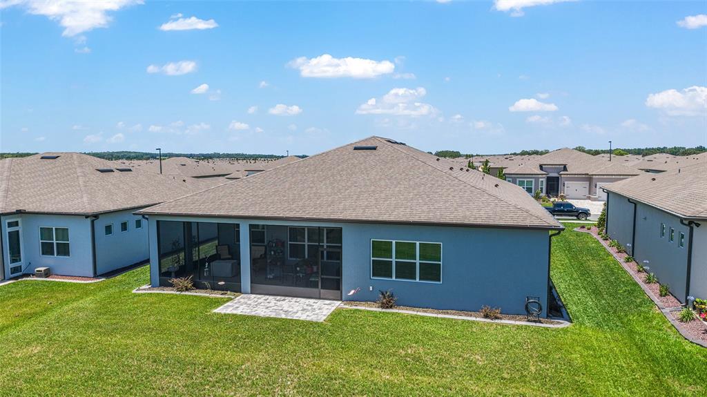6046 Southwest 86th Circle Ocala, FL 34481 - Photo 5 of 79 a front view of a house with a yard and garage