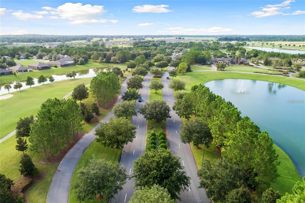6046 Southwest 86th Circle Ocala, FL 34481 - Photo 69 of 79 an aerial view of residential houses with outdoor space and lake view