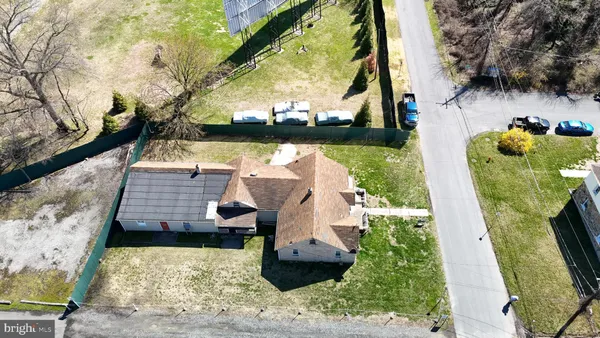 a aerial view of a house with a garden and sitting area