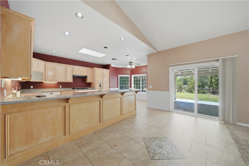 32245 Refa Street Wildomar, CA 92595 - Photo 13 of 69 a large white kitchen with a large window