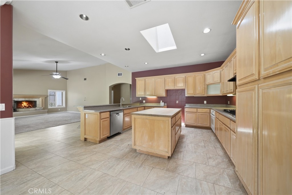 32245 Refa Street Wildomar, CA 92595 - Photo 14 of 69 a large kitchen with a large counter top appliances and cabinets