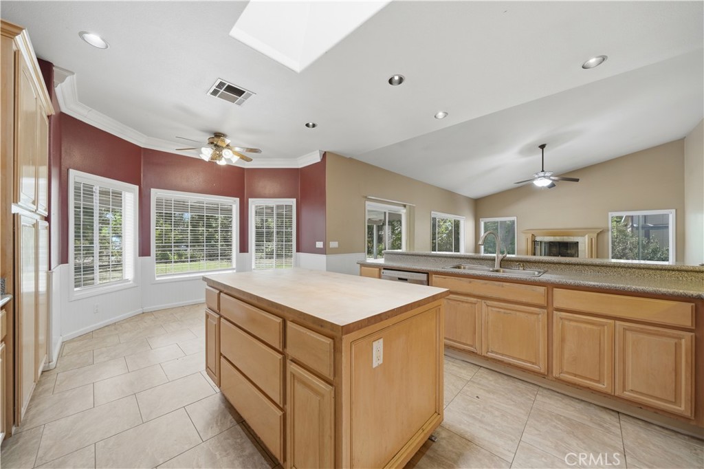 32245 Refa Street Wildomar, CA 92595 - Photo 16 of 69 a kitchen with counter top space sink and center island