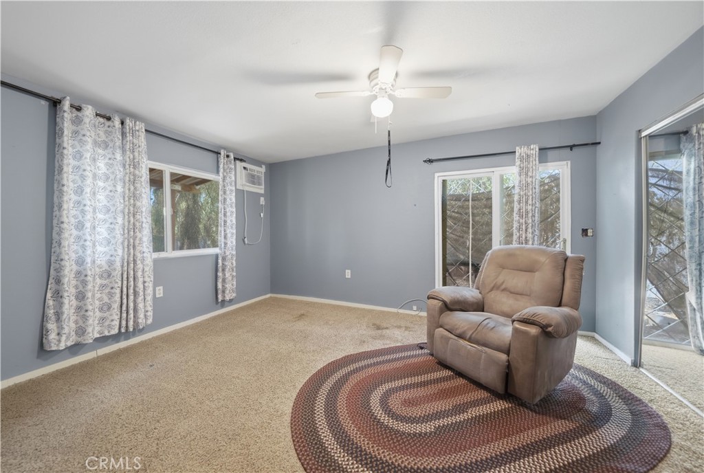 32245 Refa Street Wildomar, CA 92595 - Photo 41 of 69 a living room with furniture and a large window