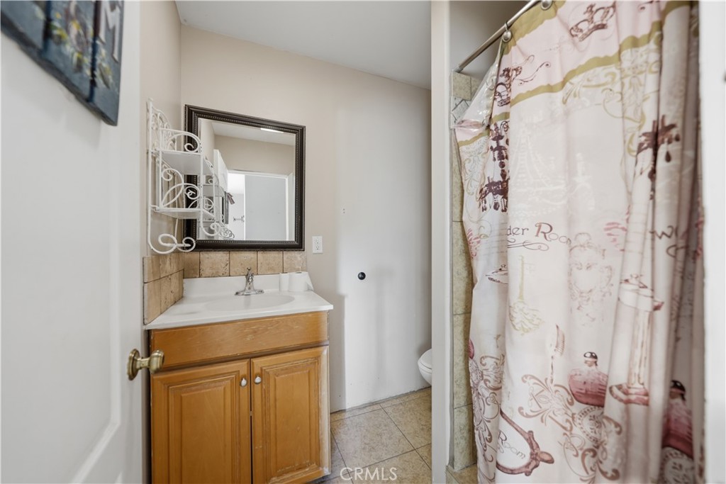 32245 Refa Street Wildomar, CA 92595 - Photo 43 of 69 a bathroom with a sink and a mirror