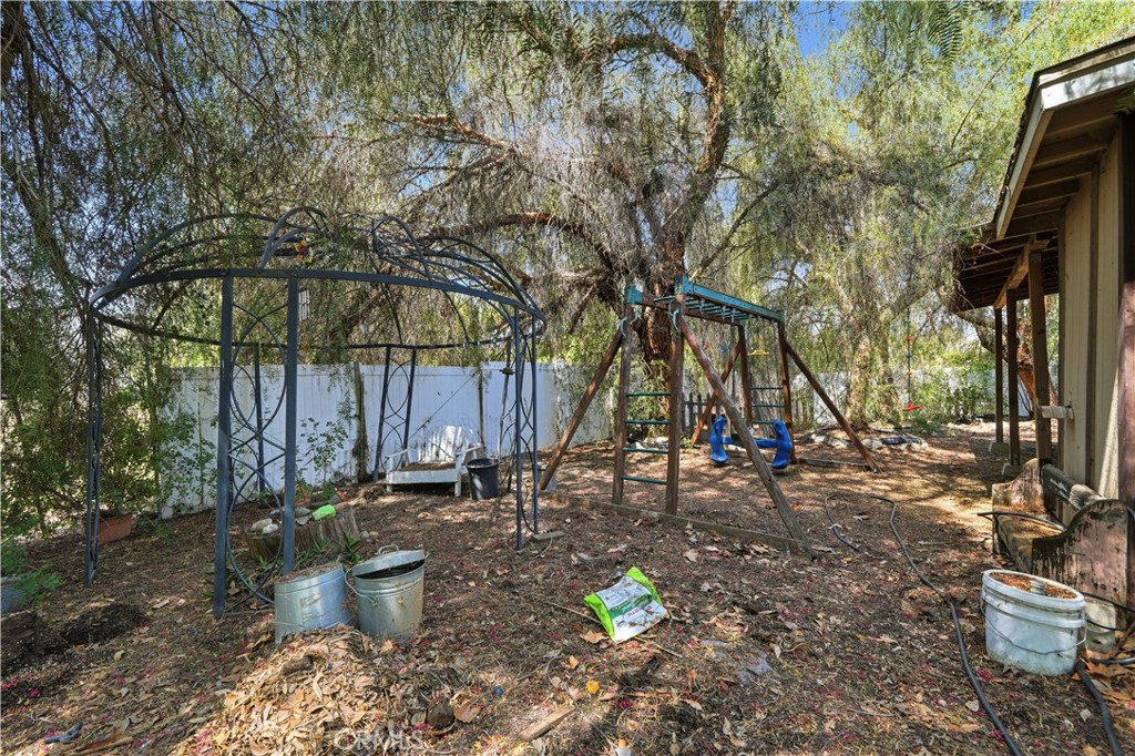 32245 Refa Street Wildomar, CA 92595 - Photo 44 of 69 a view of a backyard with plants and trees