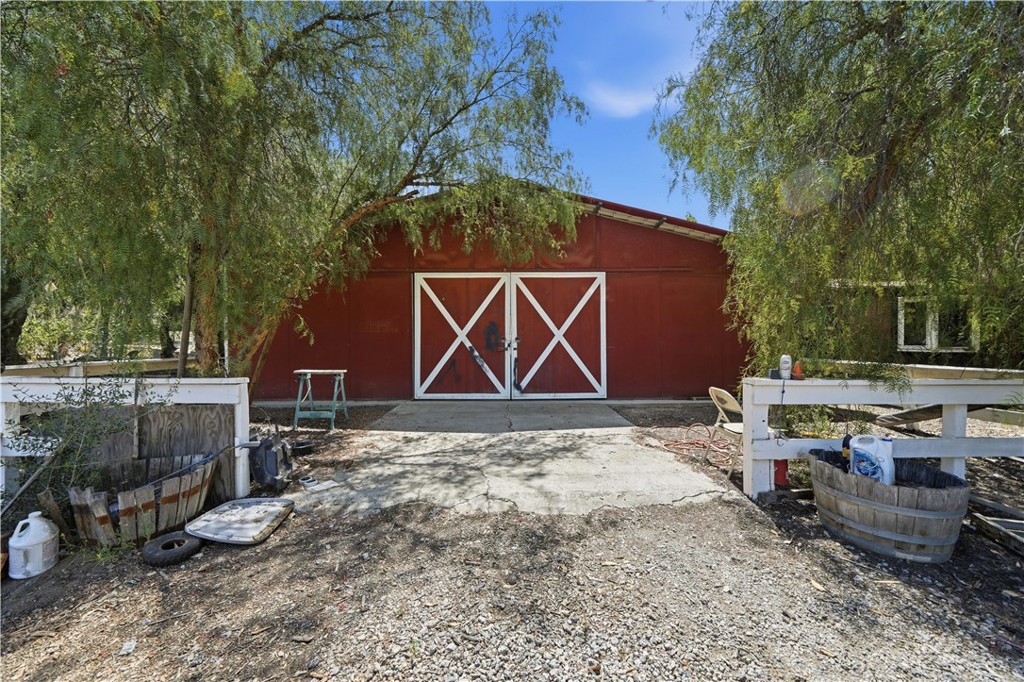 32245 Refa Street Wildomar, CA 92595 - Photo 56 of 69 a backyard of a house with barbeque oven fire pit table and chairs