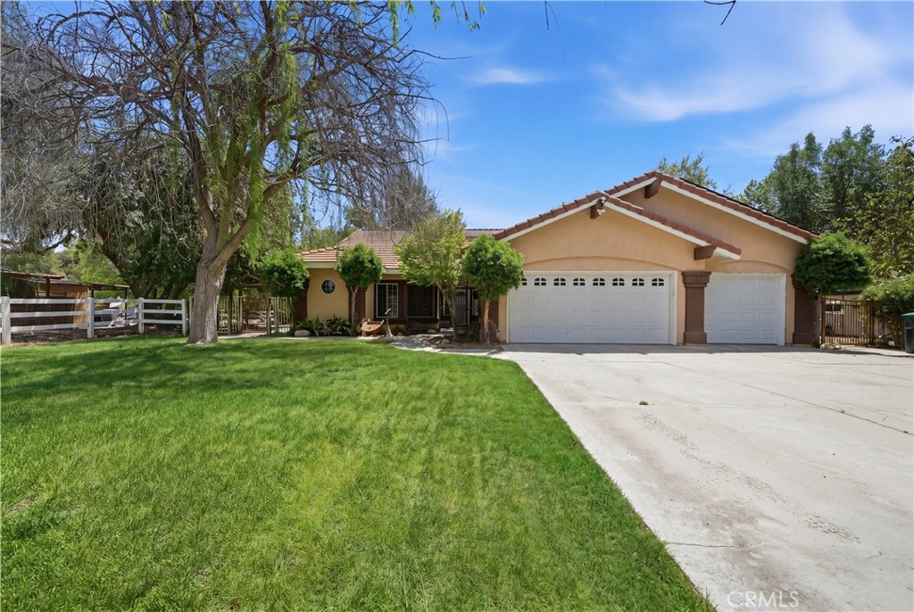 32245 Refa Street Wildomar, CA 92595 - Photo 60 of 69 a front view of a house with a garden