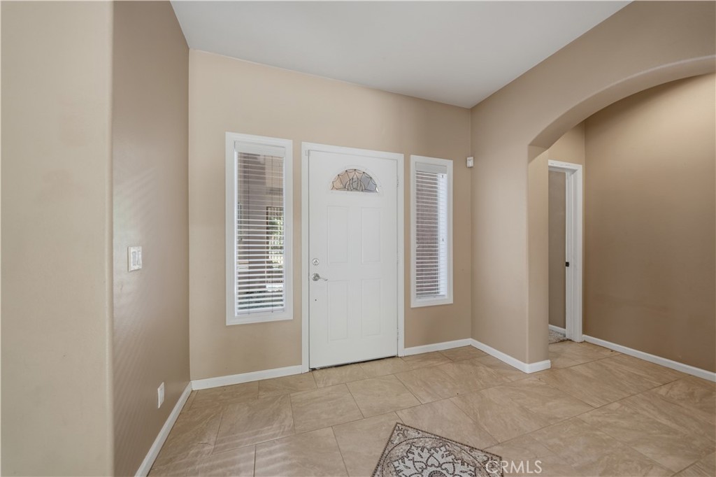32245 Refa Street Wildomar, CA 92595 - Photo 7 of 69 a view of an empty room with closet and a window