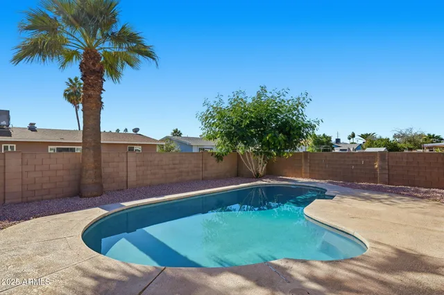 a view of a swimming pool with a lake view