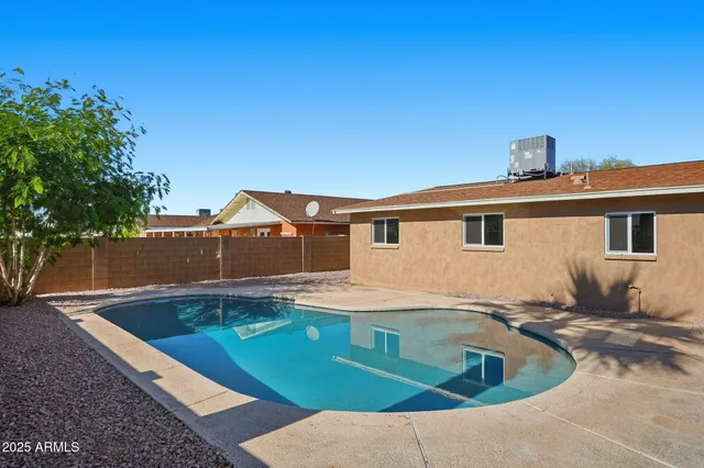 a view of a house with swimming pool