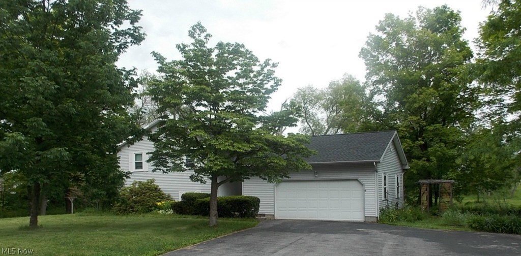 3260 Hartland Center Road Collins, OH 44826 - Photo 2 of 20 Attached 2.5 car garage has plenty of space for 2 vehicles and additional storage or workshop.