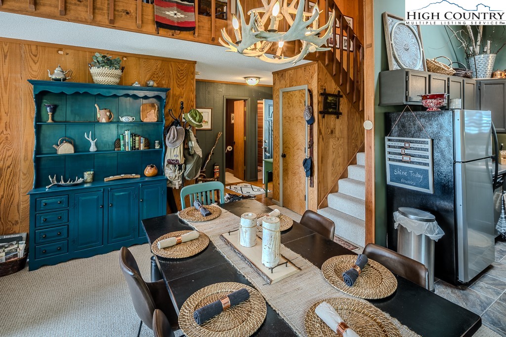 102 Spring Branch Road, Unit E Beech Mountain, NC 28604 - Photo 18 of 40 a view of a dining room with furniture