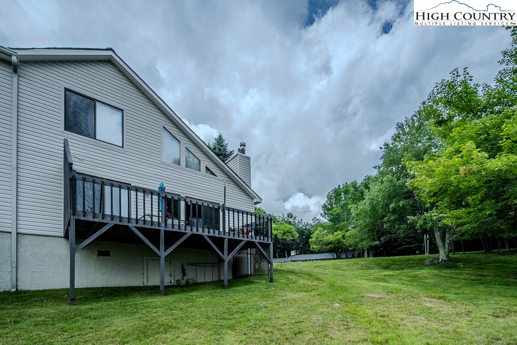 102 Spring Branch Road, Unit E Beech Mountain, NC 28604 - Photo 38 of 40 a view of backyard with deck and garden