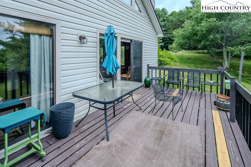 102 Spring Branch Road, Unit E Beech Mountain, NC 28604 - Photo 5 of 40 a view of balcony patio and deck
