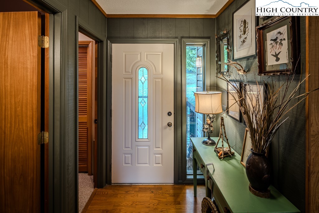 102 Spring Branch Road, Unit E Beech Mountain, NC 28604 - Photo 7 of 40 a view of an entryway with a flower pot