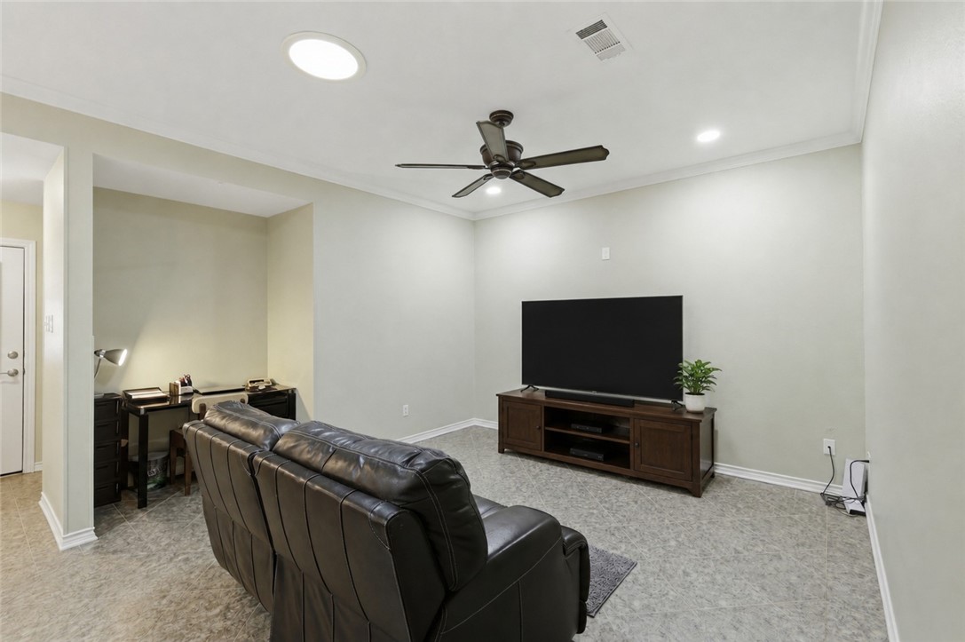 1520 Bennett Street Bryan, TX 77802 - Photo 13 of 24 a living room with furniture and a flat screen tv