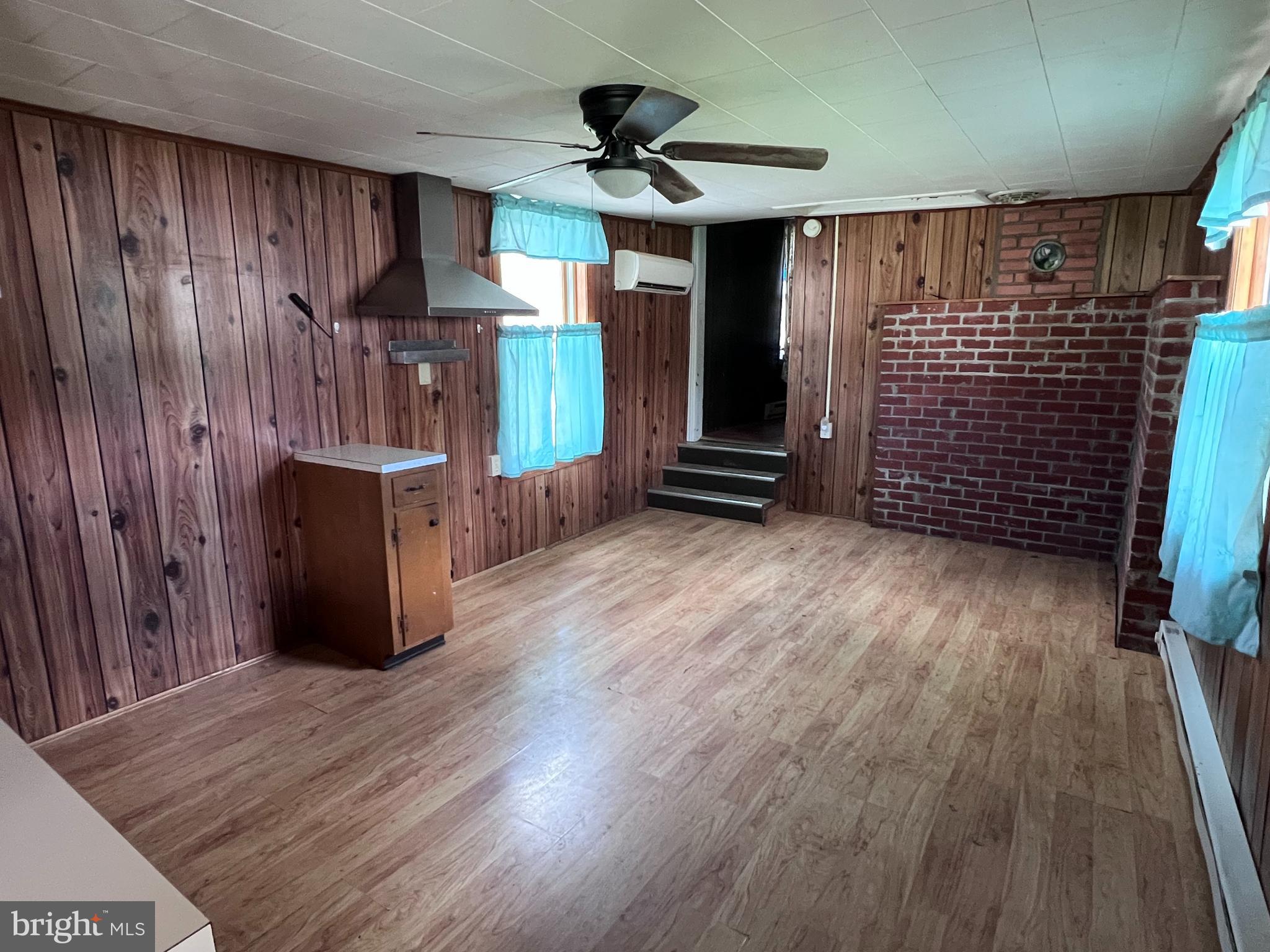 12759 Main Street Fort Loudon, PA 17224 - Photo 12 of 18 a view of an empty room with a window and wooden floor