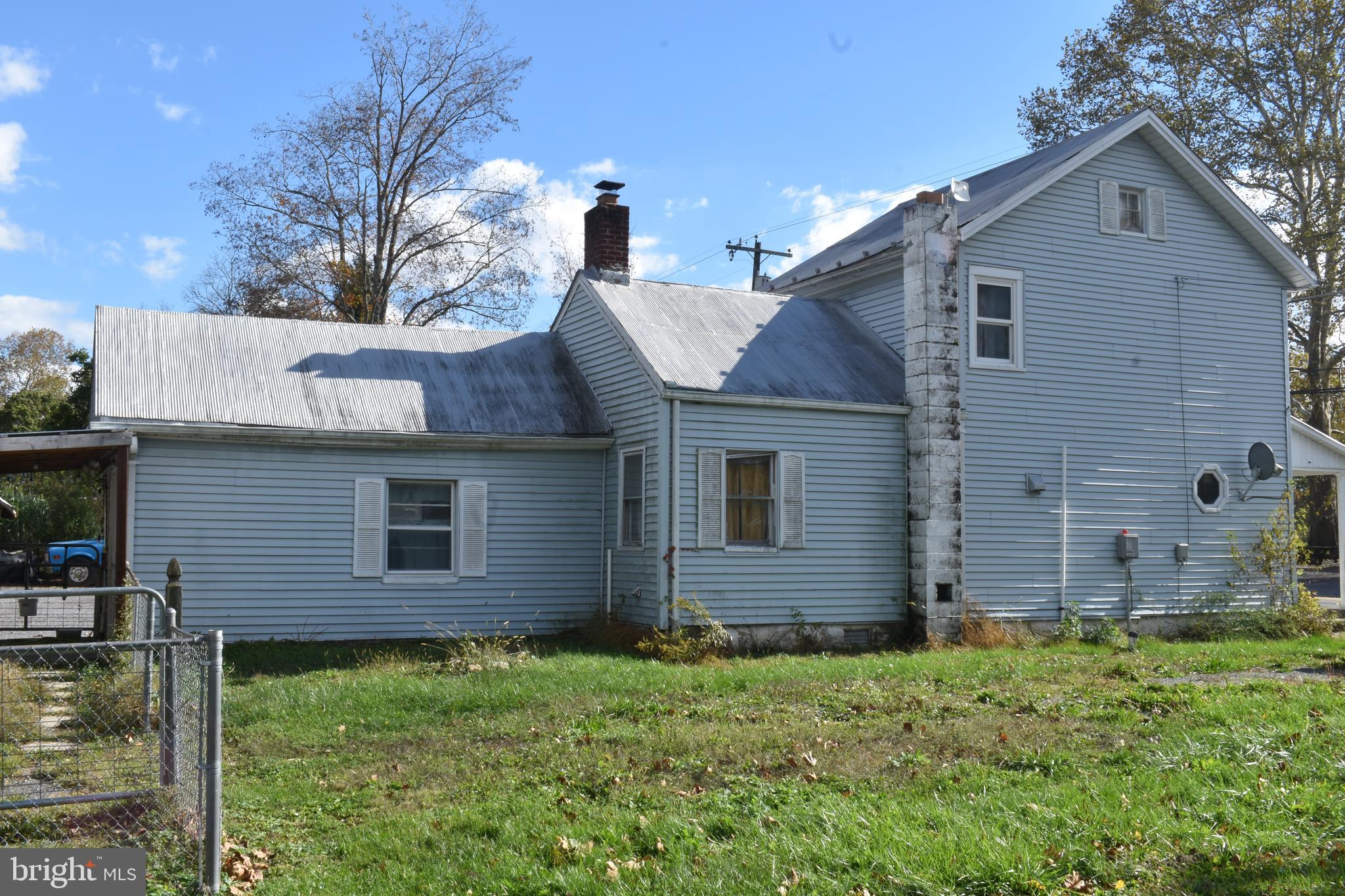 12759 Main Street Fort Loudon, PA 17224 - Photo 2 of 18 a view of a house with brick walls and a yard with plants