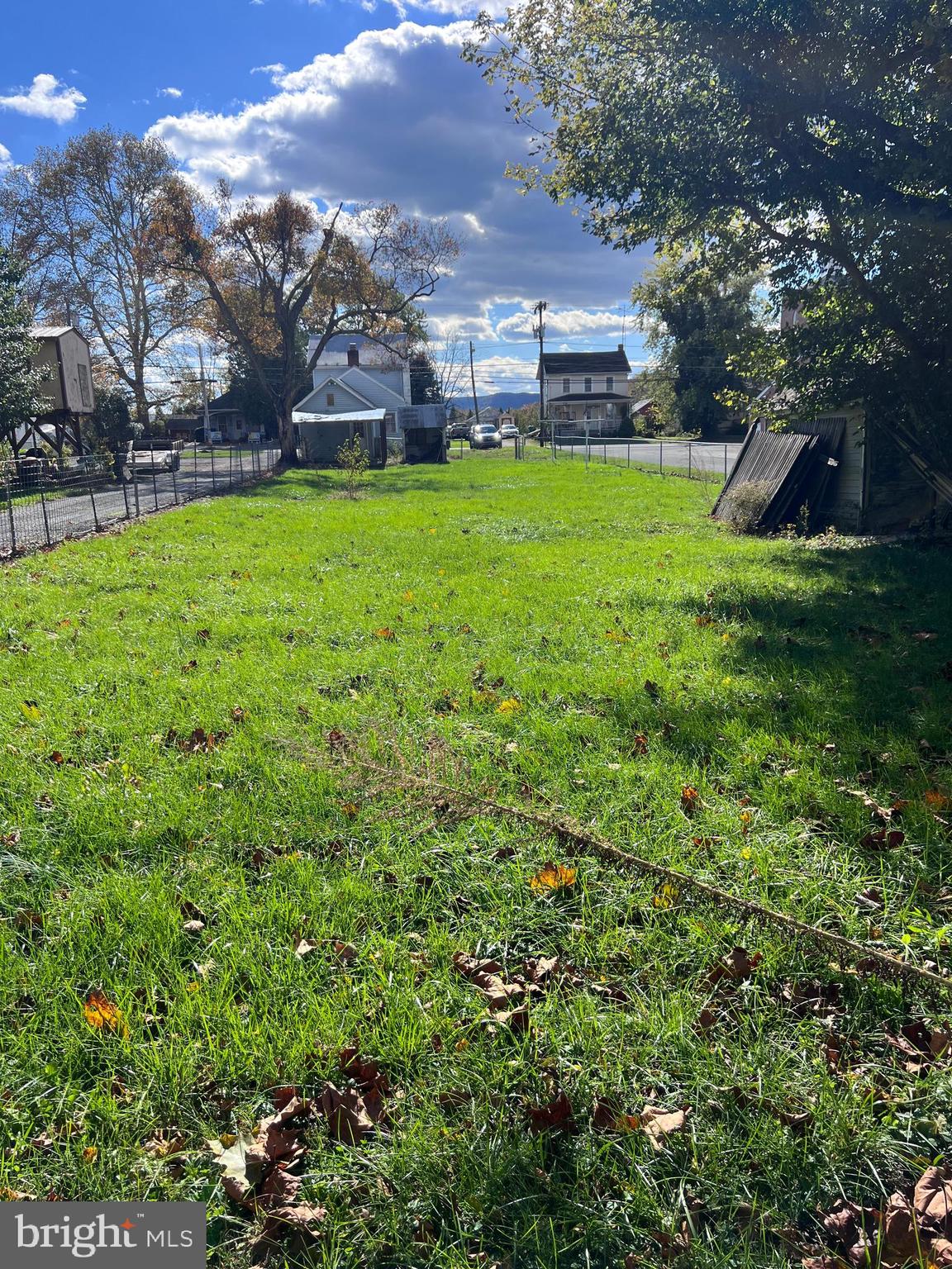12759 Main Street Fort Loudon, PA 17224 - Photo 3 of 18 a view of a house with a big yard and potted plants and large trees