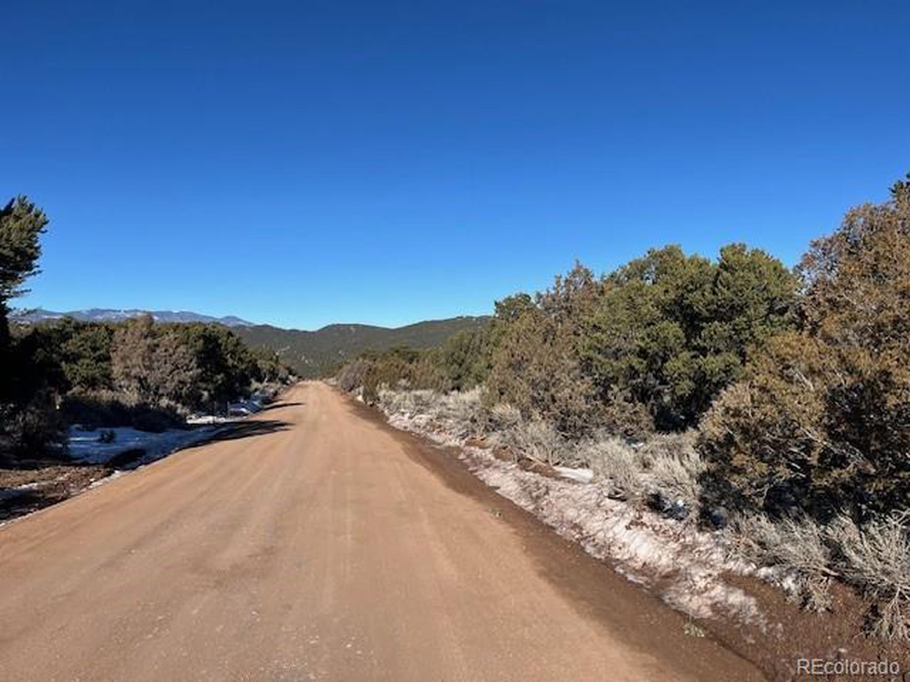 7860 Platten Road Fort Garland, CO 81133 - Photo 5 of 27 a view of a road with a mountain in the background