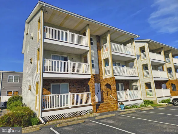 a front view of a building with a street view