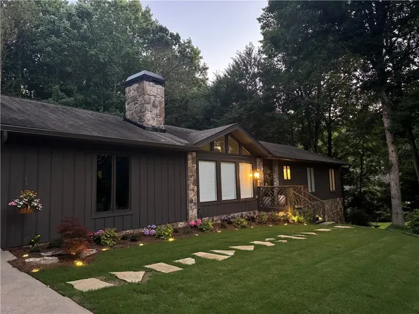 a front view of a house with a yard