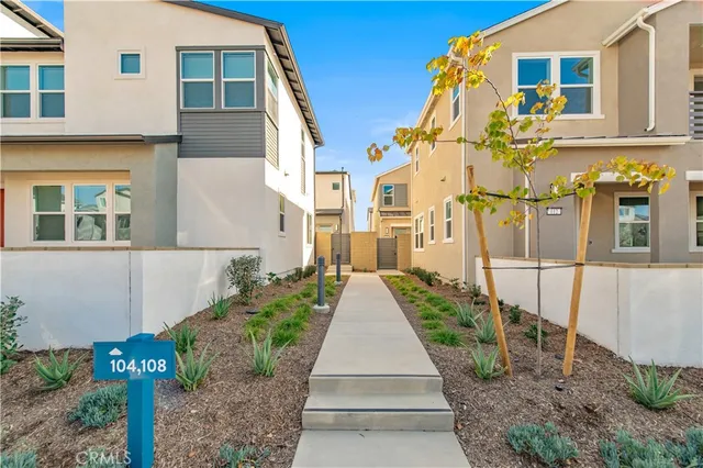 a view of a white building with many windows