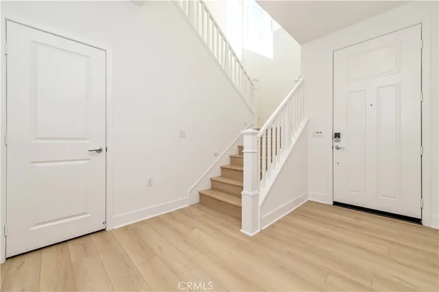 a view of entryway with wooden floor