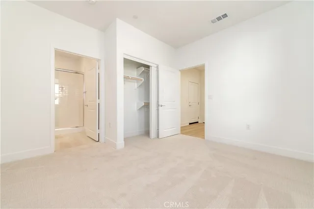 an empty room with closet area