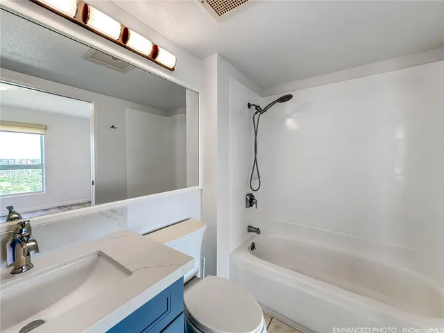 a bathroom with a sink a toilet and a bathtub