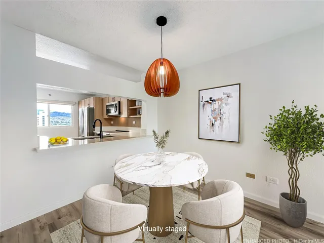 a living room with furniture and potted plant
